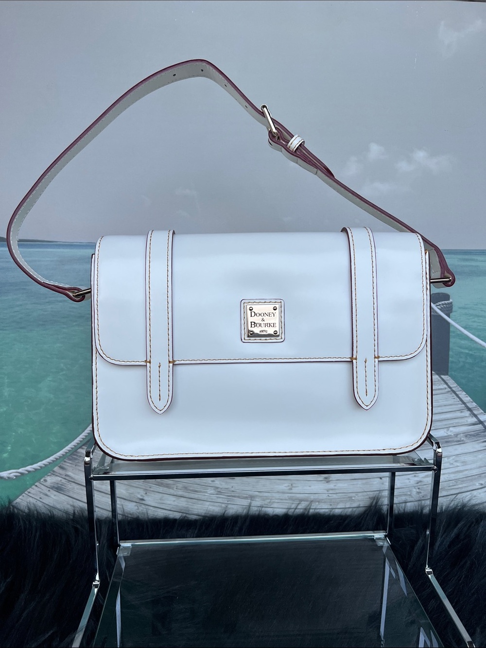 Dooney & Bourke White Leather Shoulder Bag with Contrast Trim and Red interior.